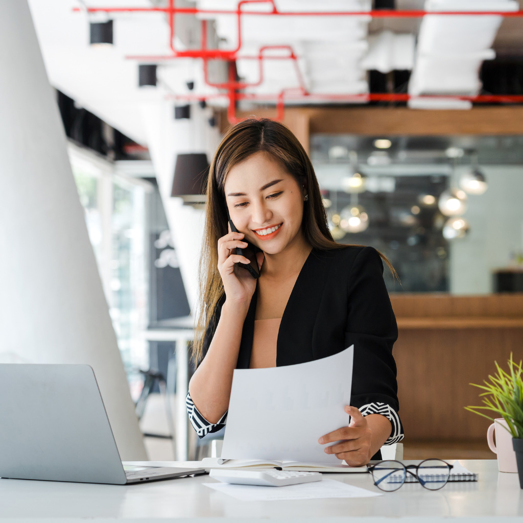 Addison Group's administrative practice page featuring a woman looking at a paper.