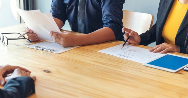 Recruiters at Addison Group reviewing candidate resumes